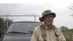 Brooks County Sheriff’s Deputy Don White outside the Ramirez Ranch gate in Brooks County, TX.
