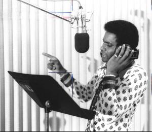 Groundbreaking country music star Charley Pride recording in the studio